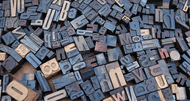 Letters spread out over a wooden table